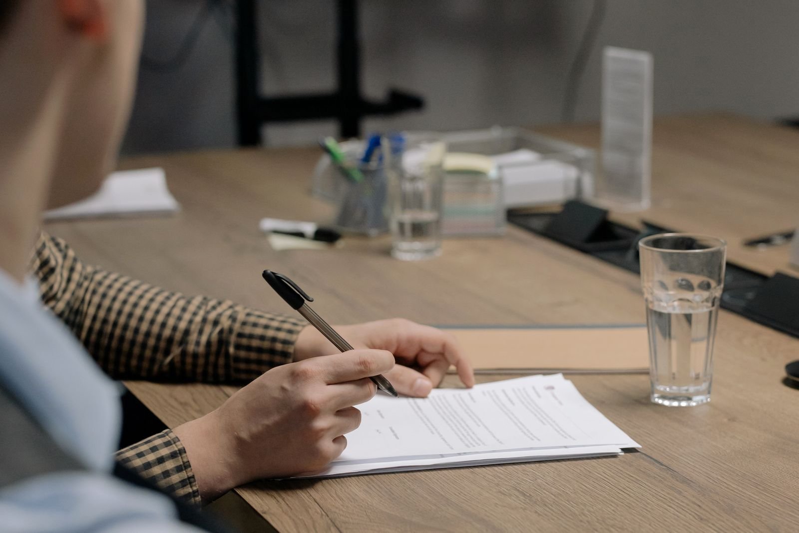 Founder reviewing and signing LLC formation and compliance documents